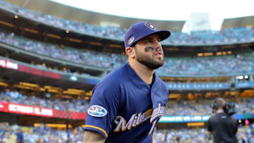 LOS ANGELES, CA - OCTOBER 16: Mike Moustakas #18 of the Milwaukee Brewers runs onto the field before Game 4 of the NLCS against the Los Angeles Dodgers at Dodger Stadium on Tuesday, October 16, 2018 in Los Angeles, California. (Photo by Alex Trautwig/MLB Photos via Getty Images)