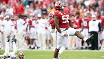 Nov 23, 2019; Tuscaloosa, AL, USA; Alabama Crimson Tide defensive lineman Christian Barmore (58) celebrates his sack on Western Carolina Catamounts quarterback Tyrie Adams (12) during the second quarter at Bryant-Denny Stadium. Mandatory Credit: John David Mercer-USA TODAY Sports