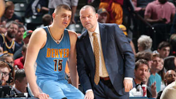 INDIANAPOLIS, IN - MARCH 24: Michael Malone of the Denver Nuggets talks with Nikola Jokic