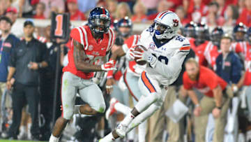 Auburn footballOct 29, 2016; Oxford, MS, USA; Auburn Tigers wide receiver Marcus Davis (80) carries the ball as he is defended by Mississippi Rebels defensive back Zedrick Woods (36) during the second half of the game at Vaught-Hemingway Stadium. Auburn won 40-29. Mandatory Credit: Matt Bush-USA TODAY Sports