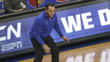 Duke Blue Devils head coach Mike Krzyzewski watches his team play the Louisville Cardinals during the second half in the second round of the 2021 ACC tournament at Greensboro Coliseum. The Duke Blue Devils won 70-56. Mandatory Credit: Nell Redmond-USA TODAY Sports