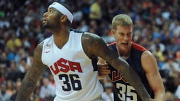 Aug 1, 2014; Las Vegas, NV, USA; USA Team Blue forward Mason Plumlee (35) reacts to his wrist being held by USA Team White center DeMarcus Cousins (36) during the USA Basketball Showcase at Thomas & Mack Center. Mandatory Credit: Stephen R. Sylvanie-USA TODAY Sports