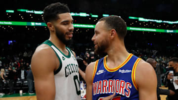 Dec 17, 2021; Boston, Massachusetts, USA; Boston Celtics forward Jayson Tatum (0) talks with Golden State Warriors guard Stephen Curry (30) after their game at TD Garden. Mandatory Credit: Winslow Townson-USA TODAY Sports