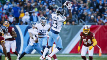 NASHVILLE, TN - DECEMBER 22: Taywan Taylor #13 of the Tennessee Titans catches a pass from Marcus Mariota #8 during the first quarter against the Washington Redskins at Nissan Stadium on December 22, 2018 in Nashville, Tennessee. (Photo by Frederick Breedon/Getty Images)