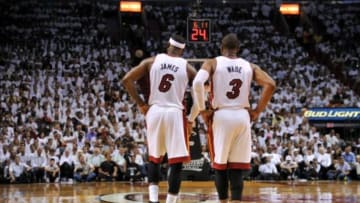 May 24, 2014; Miami, FL, USA; Miami Heat forward LeBron James (6) and guard Dwyane Wade (3) during a timeout against the Indiana Pacers in game three of the Eastern Conference Finals of the 2014 NBA Playoffs at American Airlines Arena. Mandatory Credit: Steve Mitchell-USA TODAY Sports