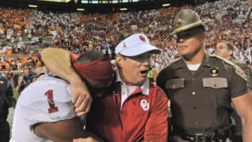 Sep 12, 2015; Knoxville, TN, USA; Oklahoma Sooners head coach Bob Stoops celebrates with wide receiver Jarvis Baxter (1) after defeating the Tennessee Volunteers in double overtime at Neyland Stadium. Oklahoma won 31-24. Mandatory Credit: Jim Brown-USA TODAY Sports