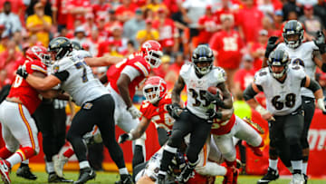 Gus Edwards #35 of the Baltimore Ravens runs for yardage against the Kansas City Chiefs (Photo by David Eulitt/Getty Images)
