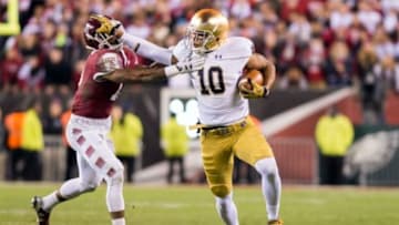Oct 31, 2015; Philadelphia, PA, USA; Notre Dame Fighting Irish tight end Alize Jones (10) runs after the catch as Temple Owls safety Nate Smith (13) defends in the third quarter at Lincoln Financial Field. Notre Dame won 24-20. Mandatory Credit: Matt Cashore-USA TODAY Sports
