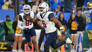 Nov 12, 2022; Pasadena, California, USA; Arizona Wildcats running back Michael Wiley (6) celebrates as he runs into the end zone for a touchdown in the first half against the UCLA Bruins at the Rose Bowl. Mandatory Credit: Jayne Kamin-Oncea-USA TODAY Sports