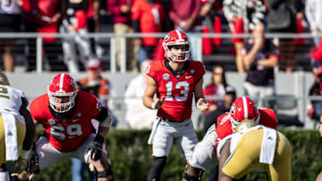 ATHENS, GA - NOVEMBER 26: Stetson Bennett #13 of the Georgia Bulldogs calls the signals during a game between Georgia Tech Yellow Jackets and Georgia Bulldogs at Sanford Stadium on November 26, 2022 in Athens, Georgia. (Photo by Steve Limentani/ISI Photos/Getty Images)