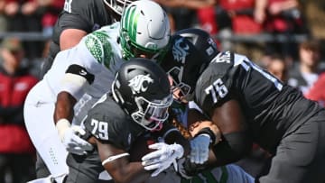 Washington State Cougars running back Jaylen Jenkins (29) carries the ball against Oregon Ducks defensive end Brandon Dorlus (3)Mandatory Credit: James Snook-USA TODAY Sports