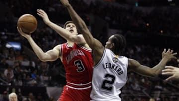 Mar 8, 2015; San Antonio, TX, USA; Chicago Bulls small forward Doug McDermott (3) shoots the ball as San Antonio Spurs small forward Kawhi Leonard (2) defends during the second half at AT&T Center. Mandatory Credit: Soobum Im-USA TODAY Sports