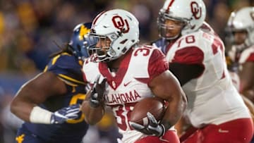 Nov 19, 2016; Morgantown, WV, USA; Oklahoma Sooners running back Samaje Perine (32) runs the ball during the second quarter against the West Virginia Mountaineers at Milan Puskar Stadium. Mandatory Credit: Ben Queen-USA TODAY Sports