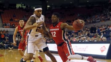 Feb 24, 2016; Auburn, AL, USA; Georgia Bulldogs guard Kenny Gaines (12) moves past Auburn Tigers forward Jordon Granger (25) during the first half at Auburn Arena. Mandatory Credit: John Reed-USA TODAY Sports