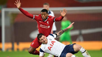Liverpool's Dutch midfielder Georginio Wijnaldum (L) clashes with Tottenham Hotspur's Danish midfielder Pierre-Emile Hojbjerg during the English Premier League football match between Liverpool and Tottenham Hotspur (Photo by PETER POWELL/POOL/AFP via Getty Images)