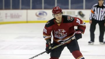 TUCSON, AZ - JANUARY 06: Tucson Roadrunners right wing Nick Merkley (38) shoots the puck during a hockey game between the Ontario Reign and Tuscon Roadrunners on January 06, 2018, at Tucson Convention Center in Tucson, AZ. Ontario Reign defeated Tucson Roadrunners 6-3. (Photo by Jacob Snow/Icon Sportswire via Getty Images)