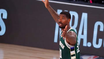 LAKE BUENA VISTA, FLORIDA - AUGUST 08: Marvin Williams #20 of the Milwaukee Bucks reacts to a call during the fourth quarter against the Dallas Mavericks at The Arena at ESPN Wide World Of Sports Complex on August 08, 2020 in Lake Buena Vista, Florida. NOTE TO USER: User expressly acknowledges and agrees that, by downloading and or using this photograph, User is consenting to the terms and conditions of the Getty Images License Agreement. (Photo by Kevin C. Cox/Getty Images)