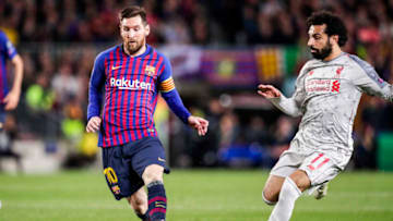 (L-R) Lionel Messi of FC Barcelona, Mohamed Salah of Liverpool FC (Photo by David S. Bustamante/Soccrates/Getty Images)