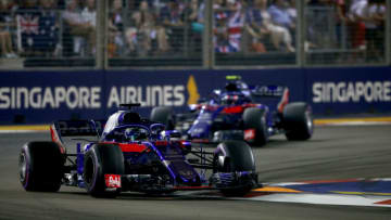 SINGAPORE - SEPTEMBER 16: Brendon Hartley of New Zealand driving the (28) Scuderia Toro Rosso STR13 Honda leads Pierre Gasly of France and Scuderia Toro Rosso driving the (10) Scuderia Toro Rosso STR13 Honda on track during the Formula One Grand Prix of Singapore at Marina Bay Street Circuit on September 16, 2018 in Singapore. (Photo by Charles Coates/Getty Images)