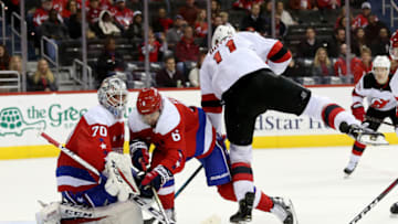 WASHINGTON, DC - NOVEMBER 30: Braden Holtby #70 of the Washington Capitals makes a save on the shot of Brian Boyle #11 of the New Jersey Devils during the third period at Capital One Arena on November 30, 2018 in Washington, DC. (Photo by Will Newton/Getty Images)