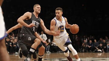 Dec 22, 2016; Brooklyn, NY, USA; Golden State Warriors guard Stephen Curry (30) drives to the basket against Brooklyn Nets center Brook Lopez (11) during the first quarter against the Golden State Warriors at Barclays Center. Mandatory Credit: Nicole Sweet-USA TODAY Sports0