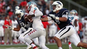 Oct 10, 2015; Reno, NV, USA; Nevada Wolf Pack defensive end Ian Seau (8) sacks New Mexico Lobos quarterback Lamar Jordan (13) in the third quarter of their NCAA football game at MacKay Stadium. Mandatory Credit: Lance Iversen-USA TODAY Sports