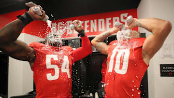 WASHINGTON, DC - MARCH 8: Jonathan Massaquoi #54 and Simmie Cobbs #10 of the DC Defenders celebrate with Bud Light Seltzer after the XFL game against the St. Louis BattleHawks at Audi Field on March 8, 2020 in Washington, DC. (Photo by Shawn Hubbard/XFL via Getty Images)