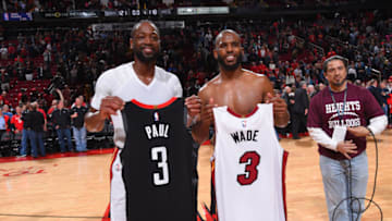 OKC Thunder : Chris Paul, and Dwyane Wade of the Miami Heat pose for a photo after exchanging jerseys (Photo by Bill Baptist/NBAE via Getty Images)