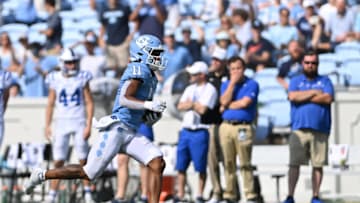 Oct 2, 2021; Chapel Hill, North Carolina, USA; North Carolina Tar Heels wide receiver Josh Downs (11) breaks free for a touchdown in the fourth quarter at Kenan Memorial Stadium. Mandatory Credit: Bob Donnan-USA TODAY Sports