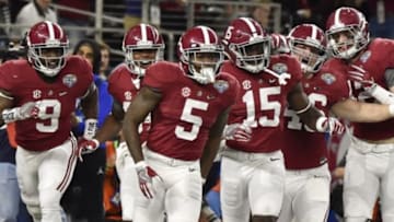 Dec 31, 2015; Arlington, TX, USA; Alabama Crimson Tide defensive back Cyrus Jones (5) celebrates a touchdown with his teammates during the third quarter against the Michigan State Spartans in the 2015 CFP semifinal at the Cotton Bowl at AT&T Stadium. Mandatory Credit: Jerome Miron-USA TODAY Sports
