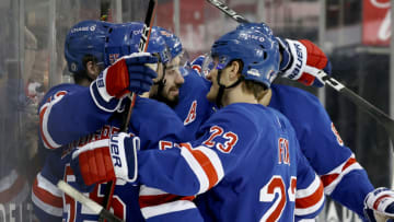 Apr 25, 2021; New York, New York, USA; Mika Zibanejad #93 of the New York Rangers is surrounded by teammates after he scored a hat trick in the second period against the Buffalo Sabres at Madison Square Garden on April 25, 2021 in New York City. Mandatory Credit: Elsa/Pool Photo-USA TODAY Sports