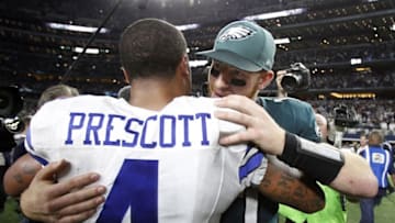 Oct 30, 2016; Arlington, TX, USA; Dallas Cowboys quarterback Dak Prescott (4) meet with Philadelphia Eagles quarterback Carson Wentz (11) after the game at AT&T Stadium. Dallas Cowboys won 29-23. Mandatory Credit: Tim Heitman-USA TODAY Sports