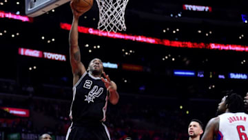 LOS ANGELES, CA - FEBRUARY 24: Kawhi Leonard #2 of the San Antonio Spurs dunks in front of Chris Paul #3, J.J. Redick #4, Austin Rivers #25 and DeAndre Jordan #6 of the LA Clippers during a 105-97 Spurs win at Staples Center on February 24, 2017 in Los Angeles, California. NOTE TO USER: User expressly acknowledges and agrees that, by downloading and or using this photograph, User is consenting to the terms and conditions of the Getty Images License Agreement. (Photo by Harry How/Getty Images)