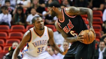 Jan 29, 2014; Miami, FL, USA; Miami Heat small forward LeBron James (6) is pressured by Oklahoma City Thunder small forward Kevin Durant (35) during the first half at American Airlines Arena. Mandatory Credit: Steve Mitchell-USA TODAY Sports