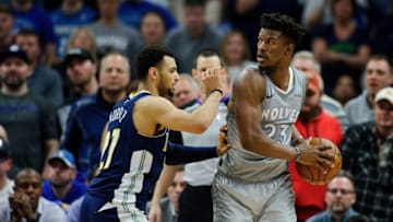 MINNEAPOLIS, MN - APRIL 11: Jamal Murray #27 of the Denver Nuggets defends against Jimmy Butler #23 of the Minnesota Timberwolves during the game on April 11, 2018 at the Target Center in Minneapolis, Minnesota. The Timberwolves defeated the Nuggets 112-106. NOTE TO USER: User expressly acknowledges and agrees that, by downloading and or using this Photograph, user is consenting to the terms and conditions of the Getty Images License Agreement. (Photo by Hannah Foslien/Getty Images)