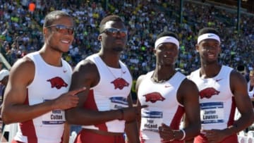 Jun 12, 2015; Eugene, OR, USA; Members of the Arkansas 4 x 100m relay pose after winning in 38.47 in the 2015 NCAA Track & Field Championships at Hayward Field. From left: Kenzo Cotton and Marqueze Washington and Omar McLeod and Jarrion Lawson. Mandatory Credit: Kirby Lee-USA TODAY Sports