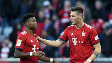 Bayern Munich's Austrian defender David Alaba (L) and his teammate Bayern Munich's defender Niklas Suele (R) speak together after the German first division Bundesliga football match Bayern Munich vs Hertha Berlin in Munich on February 23, 2019. (Photo by Christof STACHE / AFP) (Photo credit should read CHRISTOF STACHE/AFP via Getty Images)