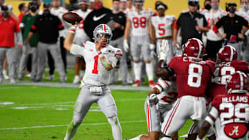 MIAMI GARDENS, FLORIDA - JANUARY 11: Justin Fields #1 of the Ohio State Buckeyes throws the ball during the College Football Playoff National Championship football game against the Alabama Crimson Tide at Hard Rock Stadium on January 11, 2021 in Miami Gardens, Florida. The Alabama Crimson Tide defeated the Ohio State Buckeyes 52-24. (Photo by Alika Jenner/Getty Images)