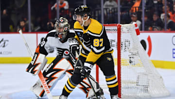 Nov 25, 2022; Philadelphia, Pennsylvania, USA; Pittsburgh Penguins center Sidney Crosby (87) stands in front of Philadelphia Flyers goalie Carter Hart (79) in the second period at Wells Fargo Center. Mandatory Credit: Kyle Ross-USA TODAY Sports