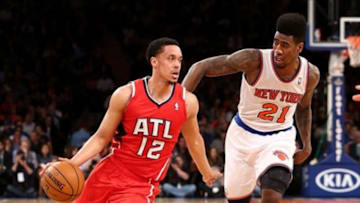 Apr. 17, 2013; New York, NY, USA; Atlanta Hawks shooting guard John Jenkins (12) dribbles the ball past New York Knicks small forward Iman Shumpert (21) during the first half at Madison Square Garden. Mandatory Credit: Debby Wong-USA TODAY Sports