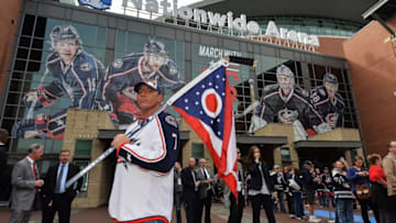 COLUMBUS, OH - OCTOBER 9: A Columbus Blue Jackets fan shows his colors outside the arena before the opening night game against the New York Rangers on October 9, 2015 at Nationwide Arena in Columbus, Ohio. (Photo by Jamie Sabau/NHLI via Getty Images)