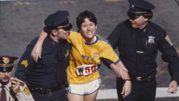 Rosie Ruiz is shown moments after crossing the finish line as the apparent women's race winner of the 84th Boston Marathon in 1980.