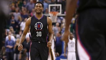 Apr 8, 2016; Salt Lake City, UT, USA; Los Angeles Clippers guard C.J. Wilcox (30)reacts after teammate guard Jamal Crawford (11) hit the game winning shot in overtime against the Utah Jazz at Vivint Smart Home Arena. The Los Angeles Clippers defeated the Utah Jazz 102-99 in overtime. Mandatory Credit: Jeff Swinger-USA TODAY Sports