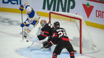Oct 24, 2023; Ottawa, Ontario, CAN; Buffalo Sabres left wing Jeff Skinner (52) shoots on Ottawa Senators goalie Joonas Korpisalo (70) in the third period at the Canadian Tire Centre. Mandatory Credit: Marc DesRosiers-USA TODAY Sports