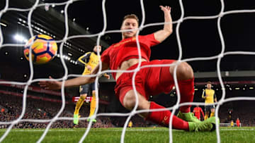 LIVERPOOL, ENGLAND - MARCH 04: Ragnar Klavan of Liverpool attempts to stop Danny Welbeck of Arsenal shot from going in but has no sucess during the Premier League match between Liverpool and Arsenal at Anfield on March 4, 2017 in Liverpool, England. (Photo by Laurence Griffiths/Getty Images)