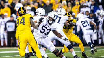 Iowa defensive end A.J. Epenesa (94) gets blocked by Penn State offensive lineman Rasheed Walker (Image via HawkCentral)