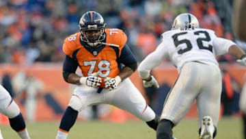 Dec 28, 2014; Denver, CO, USA; Denver Broncos tackle Ryan Clady (78) prepares to pass block on Oakland Raiders outside linebacker Khalil Mack (52) in the second quarter at Sports Authority Field at Mile High. Mandatory Credit: Ron Chenoy-USA TODAY Sports