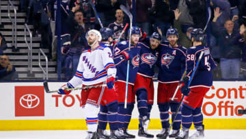 COLUMBUS, OH - JANUARY 13: Kevin Shattenkirk #22 of the New York Rangers skates off of the ice as Nick Foligno #71 of the Columbus Blue Jackets is congratulated by his teammates after scoring a goal during the third period on January 13, 2019 at Nationwide Arena in Columbus, Ohio. Columbus defeated New York 7-5. (Photo by Kirk Irwin/Getty Images)