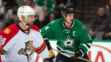 Feb 13, 2015; Dallas, TX, USA; Florida Panthers right wing Brad Boyes (24) and Dallas Stars left wing Jamie Benn (14) look for the puck during the second period at the American Airlines Center. Benn scores a goal in the first. Mandatory Credit: Jerome Miron-USA TODAY Sports