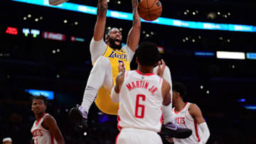 Nov 2, 2021; Los Angeles, California, USA; Los Angeles Lakers forward Anthony Davis (3) dunks for a basket in front of Houston Rockets forward Kenyon Martin Jr. (6) during the second half at Staples Center. Mandatory Credit: Gary A. Vasquez-USA TODAY Sports